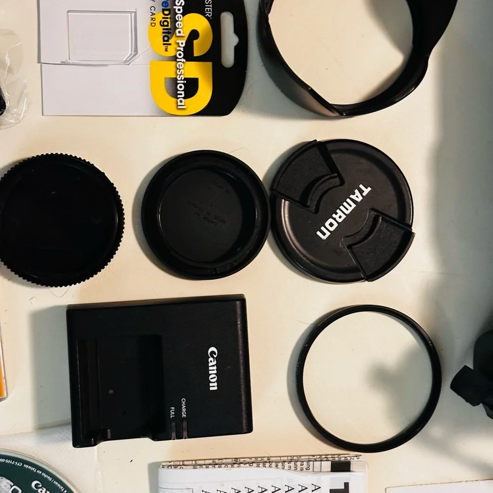 Canon DSLR with Black Tamron Zoom Lens and Red-Trim Strap